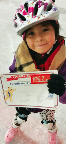 Young skater holding certificate